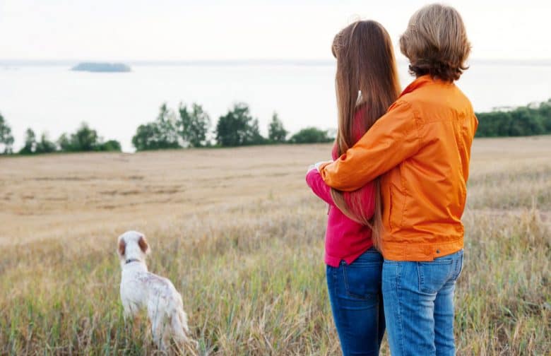 Mother and daughter with their Irish Setter dog